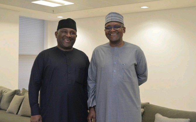 an image of dangote and rabiu, standing and smiling