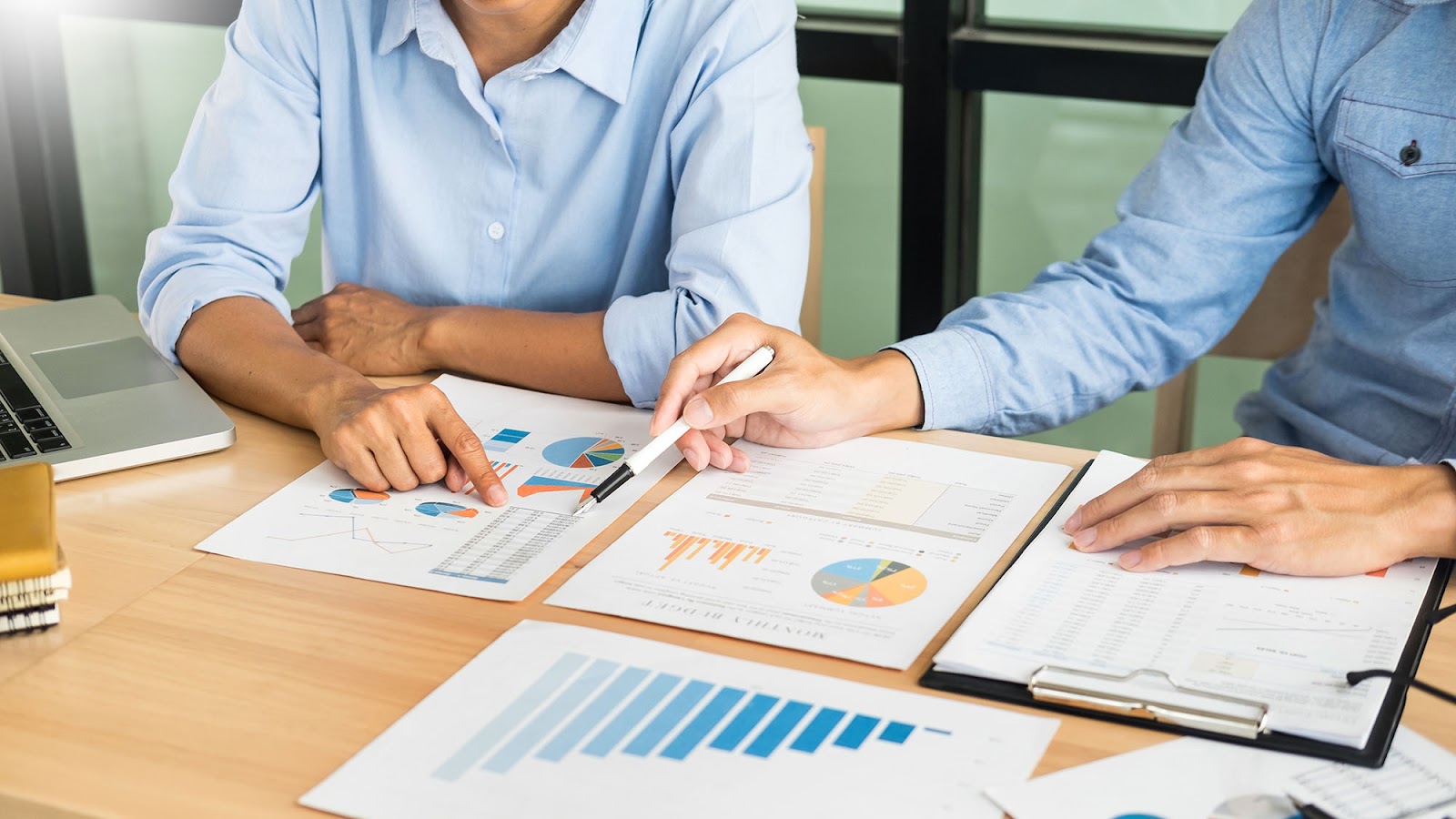 Workers executing startup risk assessment for risk management plan