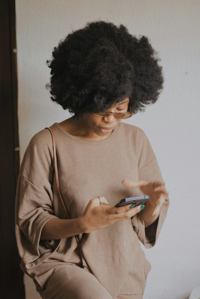 A woman budgeting her finances and planning to automate emergency fund