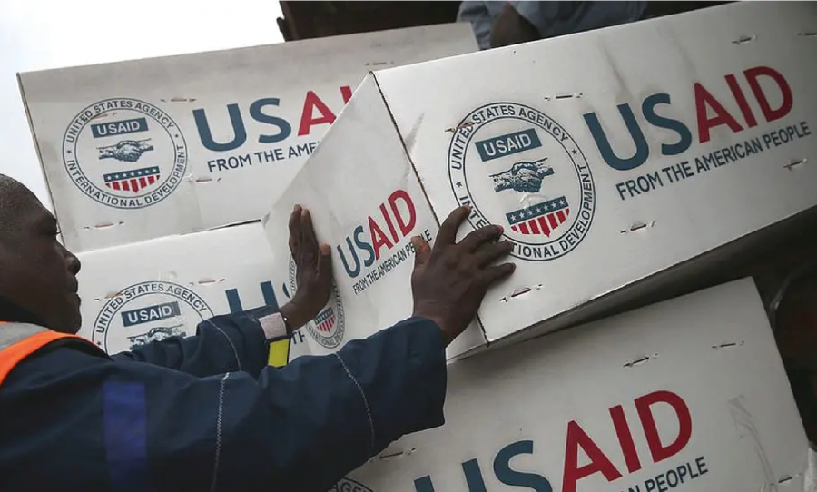 usaid supplies being loaded off a truck