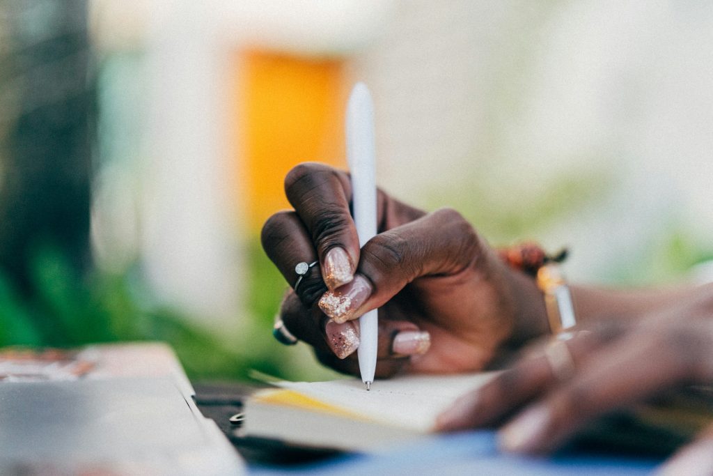 A lady taking notes in her journal