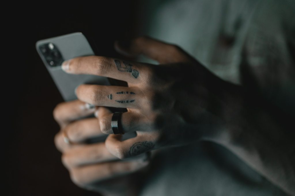 A man planning to automate emergency fund on his phone