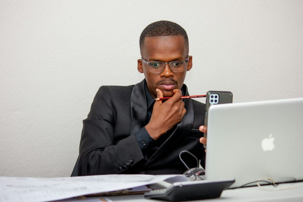 A man reviewing his expenses - tips on saving money