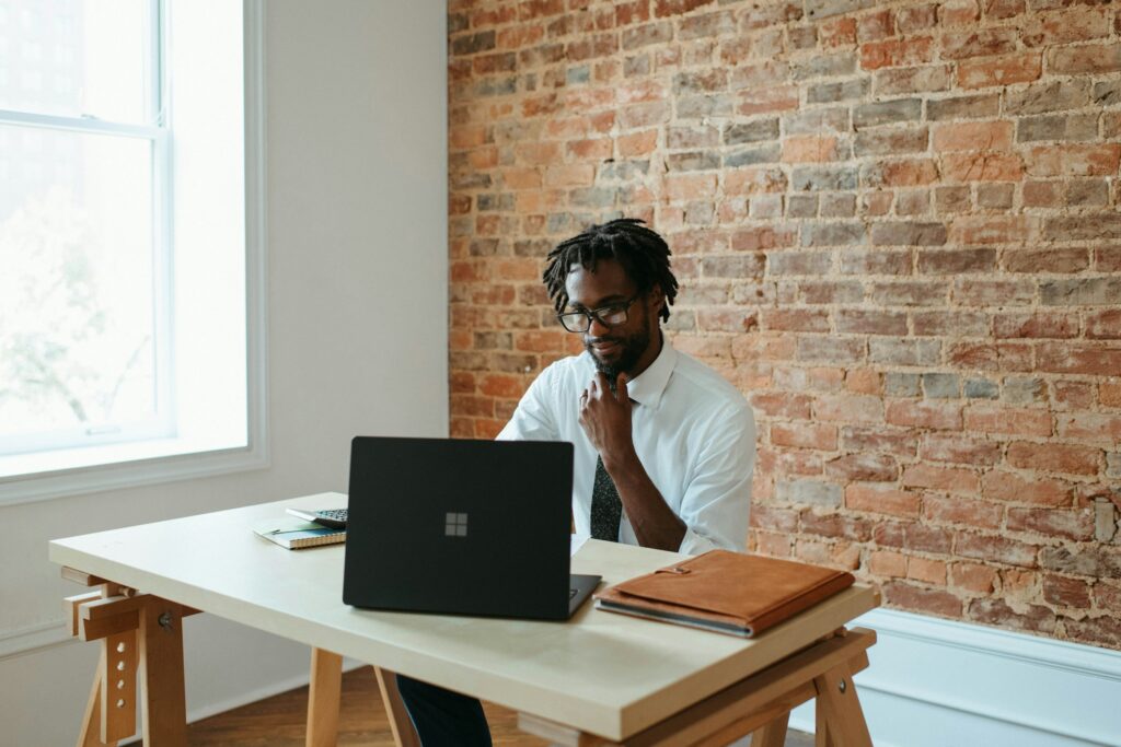 A man with laptop in an office