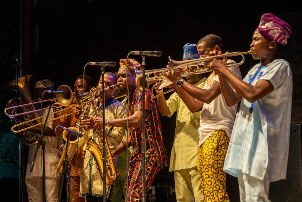Nigerian instrumentalists performing afrobeat music on stage