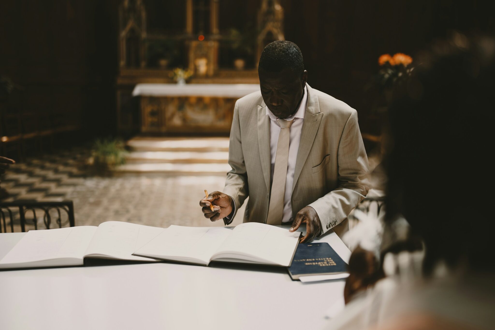 A man filling some forms for hotel business requirements in Nigeria